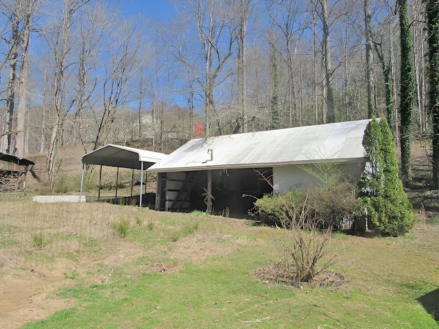 138 Brittain Trce, Andrews, NC 28901 - view of property exterior with a detached carport and an outdoor structure