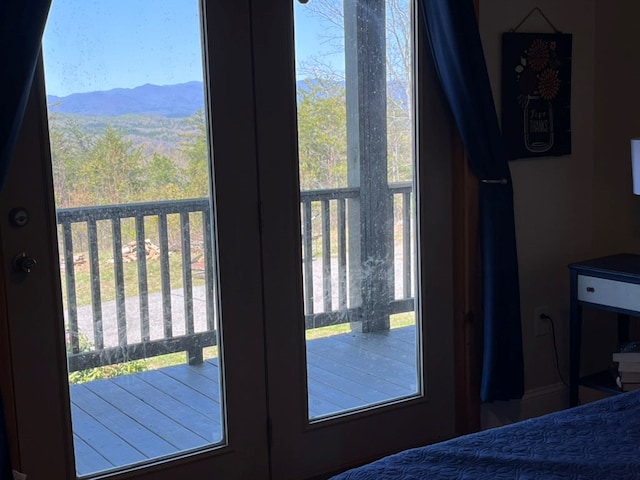 bedroom featuring a mountain view