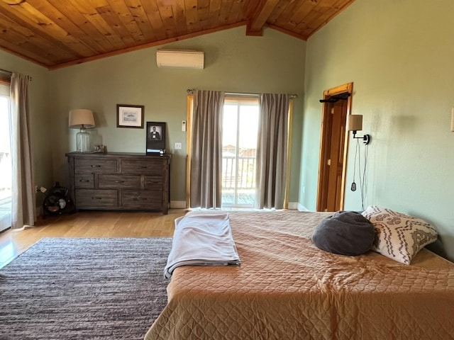 bedroom with a wall mounted air conditioner, light wood-style flooring, multiple windows, and vaulted ceiling