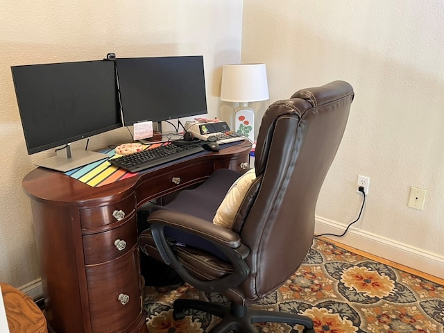 office area featuring baseboards