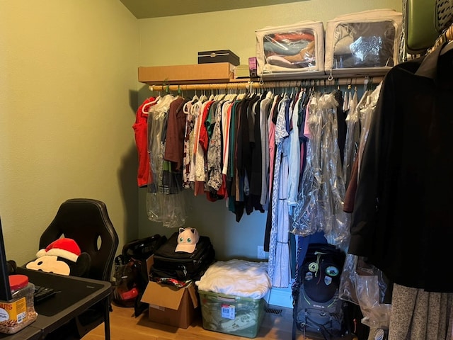 spacious closet with wood finished floors