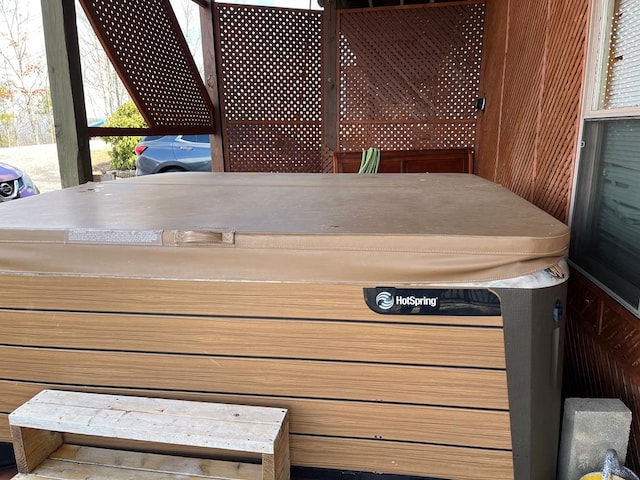 exterior space with a hot tub