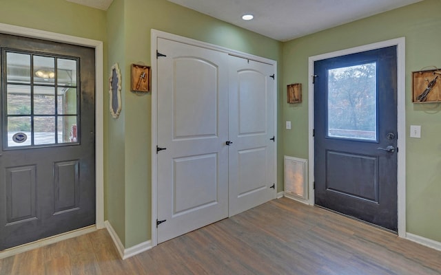 entryway with hardwood / wood-style floors