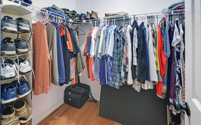 walk in closet featuring hardwood / wood-style floors