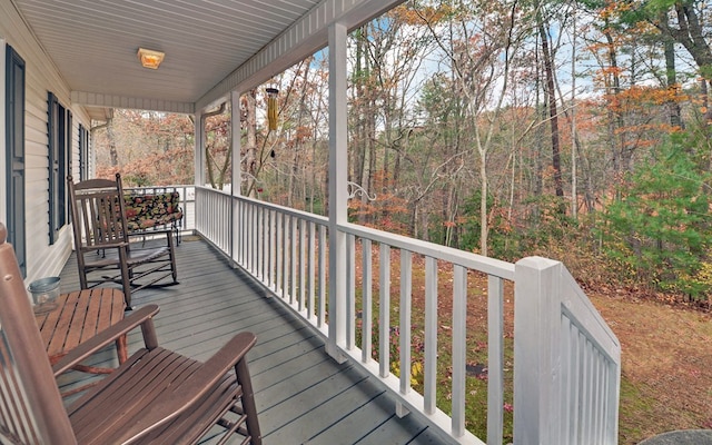 wooden terrace featuring a porch