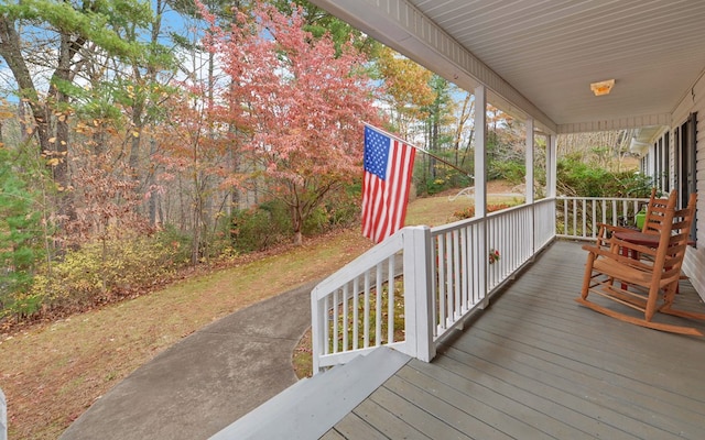 wooden terrace with a porch