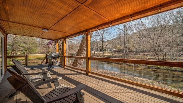 wooden terrace with grilling area