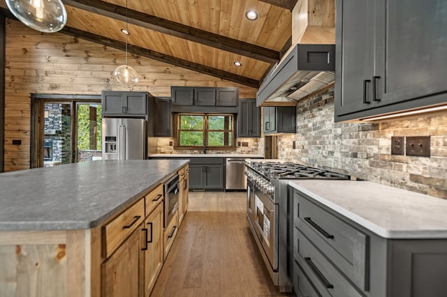 kitchen featuring wood ceiling, vaulted ceiling with beams, premium appliances, custom exhaust hood, and light wood-type flooring