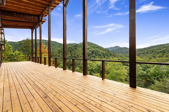 wooden deck with a mountain view