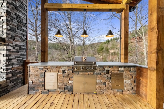 deck featuring area for grilling and a grill