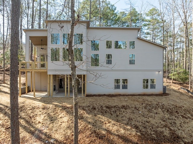 back of property with a patio area and ceiling fan