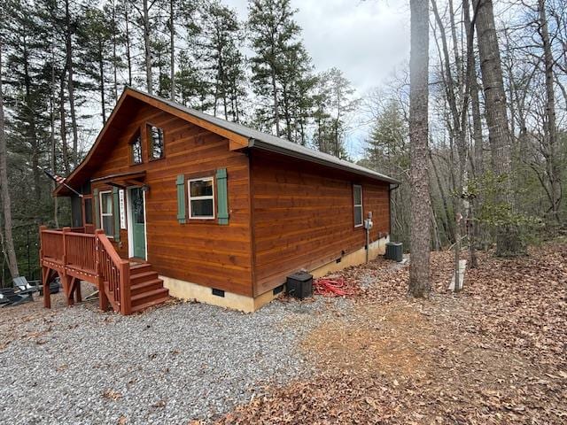 view of home's exterior featuring crawl space and cooling unit