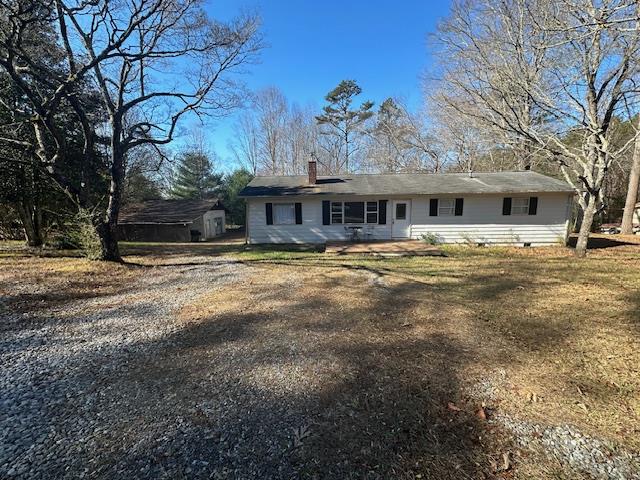 rear view of house with a lawn