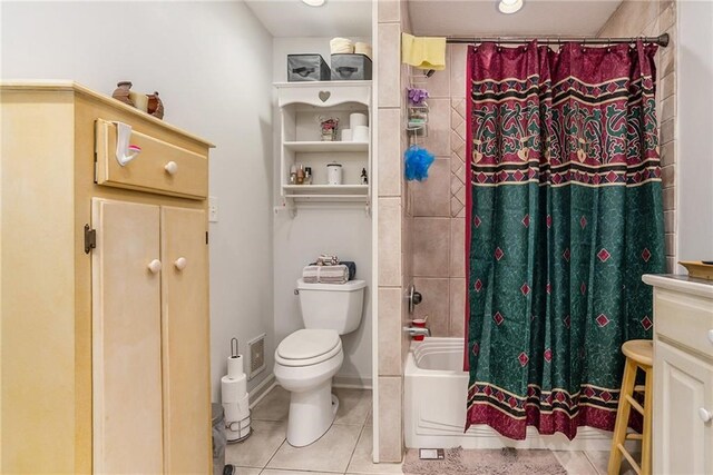 full bathroom with vanity, tile patterned flooring, toilet, and shower / tub combo