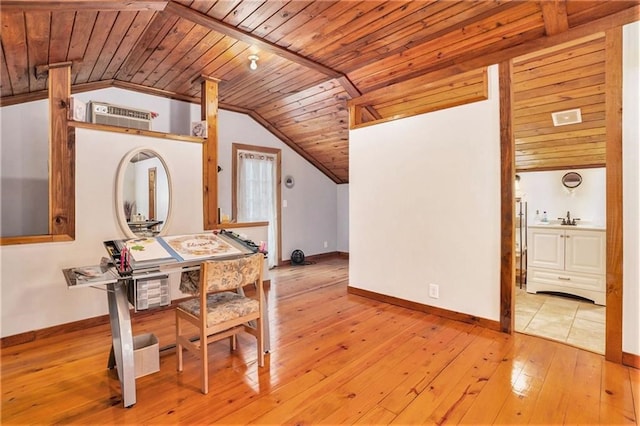 interior space with sink, vaulted ceiling, wooden ceiling, and light hardwood / wood-style floors