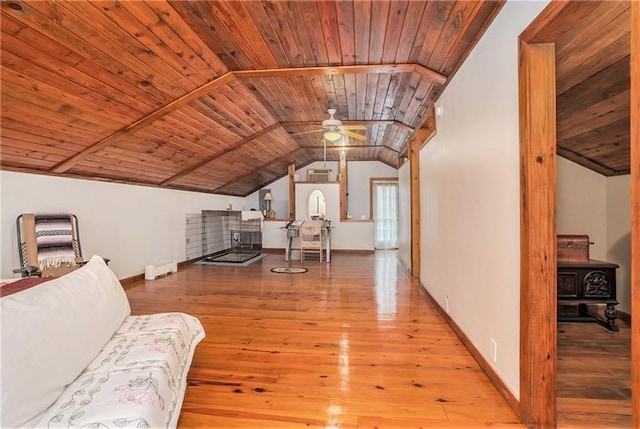 interior space featuring lofted ceiling, wooden ceiling, ceiling fan, and light hardwood / wood-style flooring