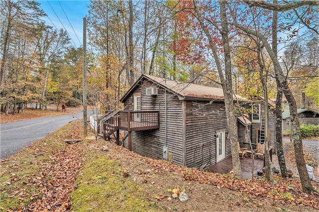 view of side of home featuring a deck