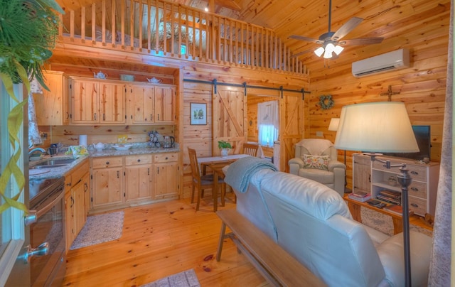 15 June Marie Ln, Murphy, NC 28906 - living area with a barn door, a wall mounted air conditioner, wooden walls, ceiling fan, and wood ceiling
