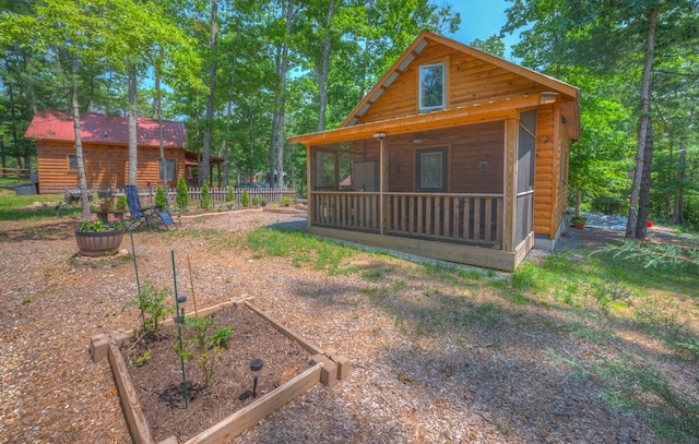 15 June Marie Ln, Murphy, NC 28906 - view of front of property featuring a vegetable garden and faux log siding