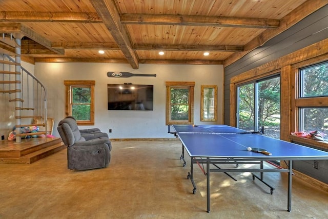 recreation room featuring wooden ceiling, beam ceiling, and wooden walls