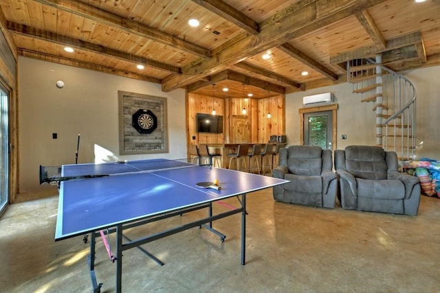 game room featuring concrete flooring, wood ceiling, beam ceiling, and a wall mounted air conditioner