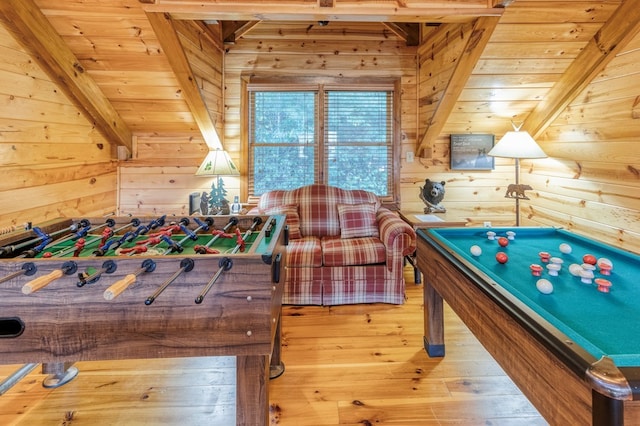 rec room featuring beam ceiling, wood ceiling, wooden walls, and hardwood / wood-style floors