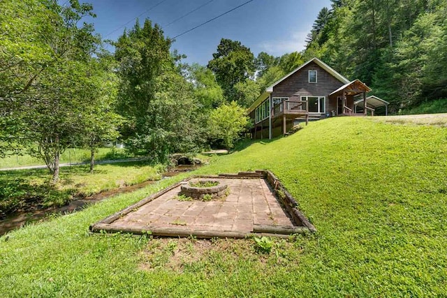 132 Silver Birch Ln, Marble, NC 28905 - view of green lawn featuring an outdoor fire pit and a deck