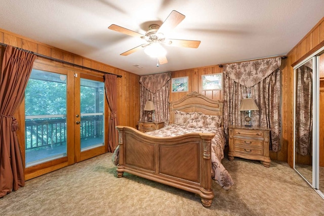132 Silver Birch Ln, Marble, NC 28905 - carpeted bedroom featuring access to exterior, wood walls, and ceiling fan