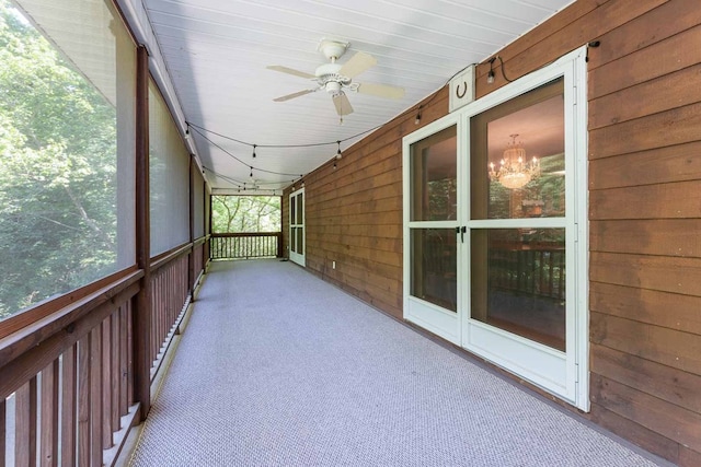 132 Silver Birch Ln, Marble, NC 28905 - unfurnished sunroom featuring a ceiling fan and a chandelier