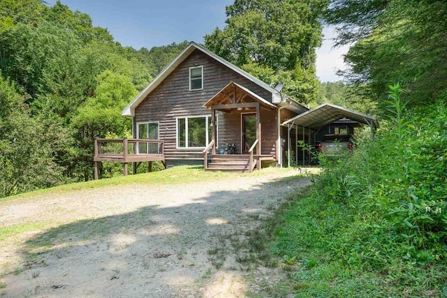 132 Silver Birch Ln, Marble, NC 28905 - chalet / cabin featuring a carport, a wooden deck, and a forest view