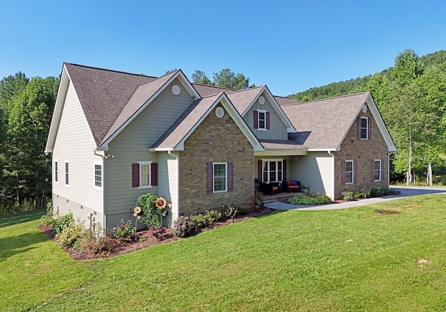 craftsman-style home with a front yard