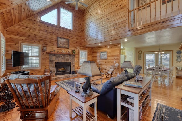 2478 Hi River Rd, Hiawassee, GA 30546 - living room with a wealth of natural light and wood walls