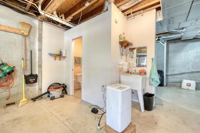 2478 Hi River Rd, Hiawassee, GA 30546 - unfinished basement with a sink and a wood stove
