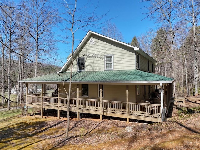 2478 Hi River Rd, Hiawassee, GA 30546 - farmhouse-style home with covered porch and metal roof