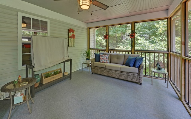 sunroom featuring ceiling fan