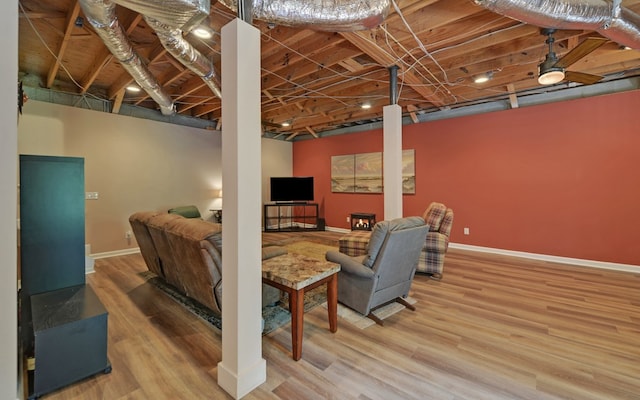 basement with hardwood / wood-style floors