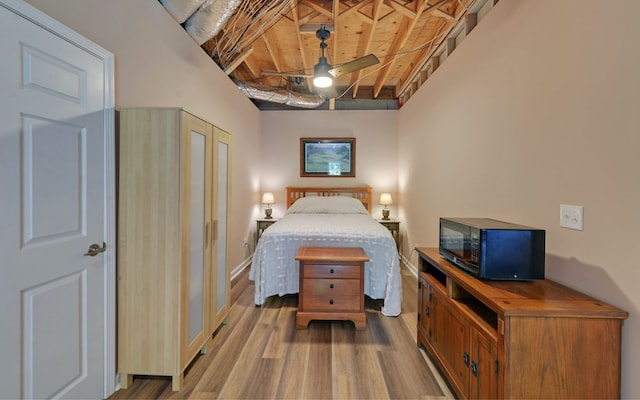 bedroom featuring wooden ceiling, beamed ceiling, and light wood-type flooring