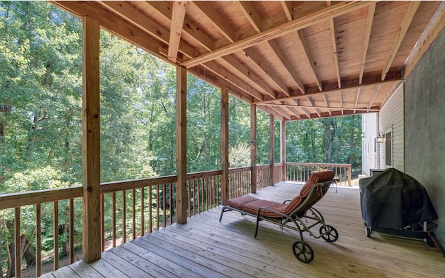 wooden terrace with a grill