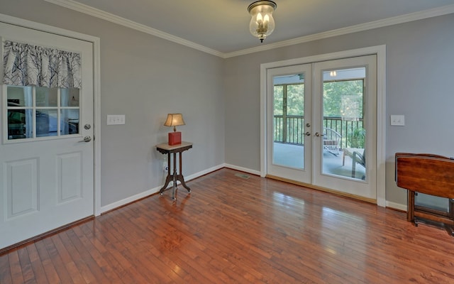 doorway to outside featuring crown molding, hardwood / wood-style floors, and french doors