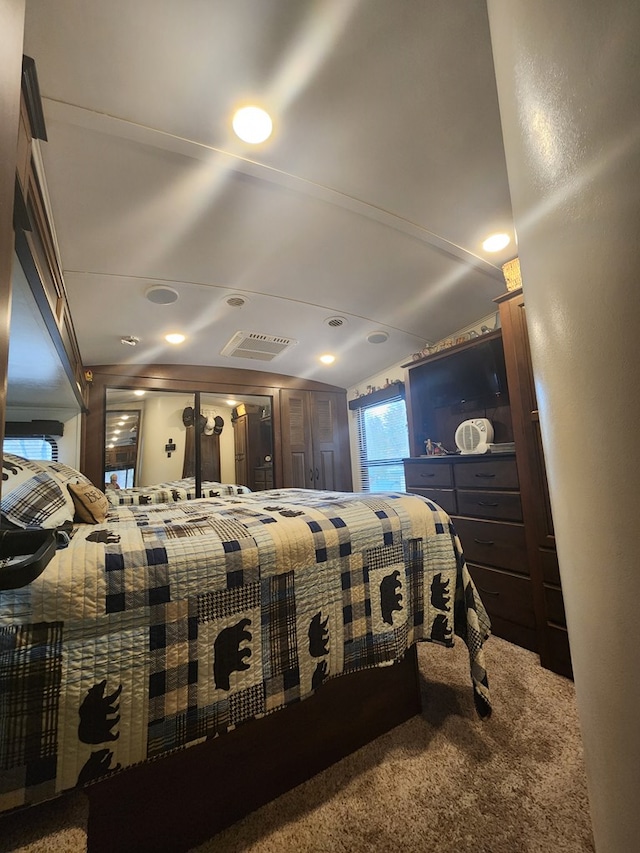 carpeted bedroom with visible vents