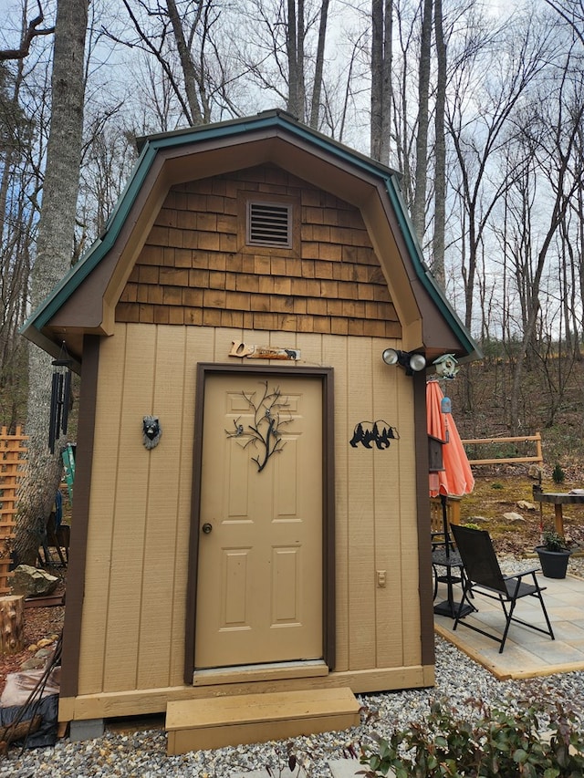 view of shed with fence