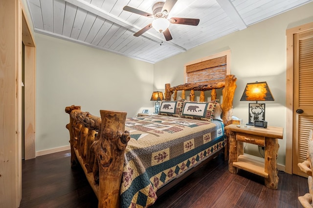 bedroom with ceiling fan, baseboards, wood ceiling, and wood finished floors