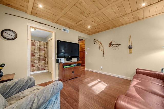 living room featuring beam ceiling, visible vents, wood ceiling, and wood finished floors