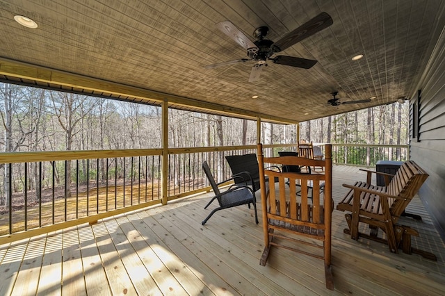 wooden deck featuring ceiling fan