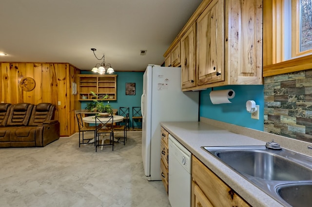 539 Nicholson Trl, Hiawassee, GA 30546 - kitchen with white dishwasher, a sink, light countertops, a chandelier, and wood walls