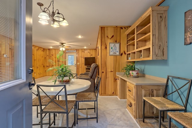 539 Nicholson Trl, Hiawassee, GA 30546 - dining room with wooden walls, a ceiling fan, a chandelier, and recessed lighting