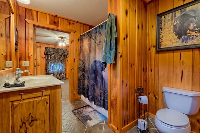 539 Nicholson Trl, Hiawassee, GA 30546 - full bath with wood walls, vanity, tile patterned flooring, toilet, and a shower with curtain