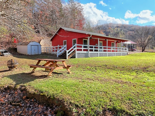 539 Nicholson Trl, Hiawassee, GA 30546 - view of shed with a fire pit