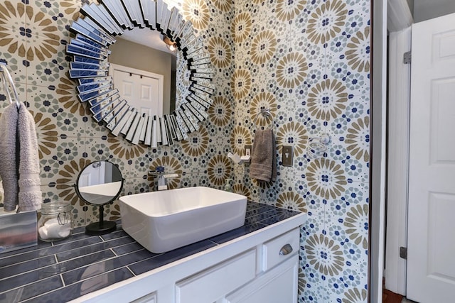 bathroom featuring tasteful backsplash and vanity