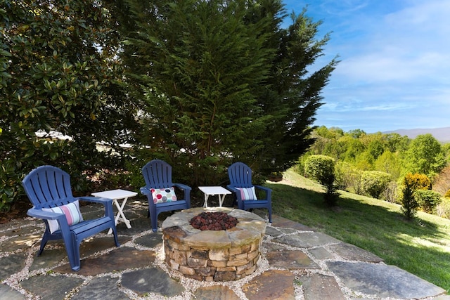 view of patio / terrace with a fire pit